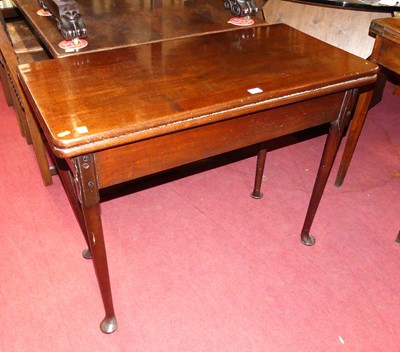 Lot 1287 - An early George III mahogany fold-over tea...