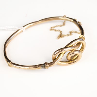 Lot 303 - A 9ct hollow gold hinged bangle with safety...
