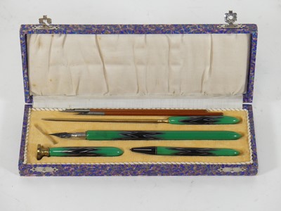 Lot 467 - A cased writing set, comprising a pen, a...