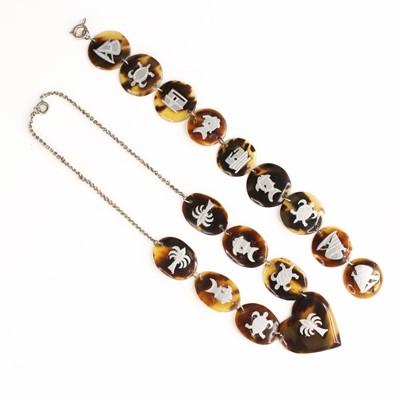 Lot 324 - A faux tortoiseshell and silver pique worked...