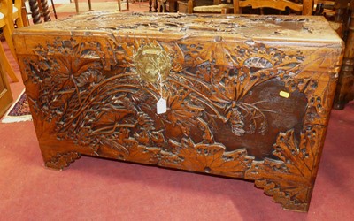 Lot 1312 - An Eastern relief carved camphor wood hinge...