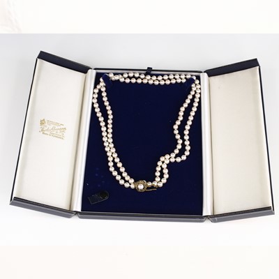 Lot 348 - A cultured pearl long necklace, strung knotted,...