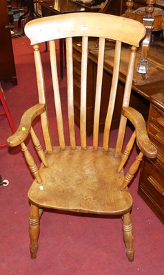 Lot 1323 - An early 20th century elm seat and beech slat...