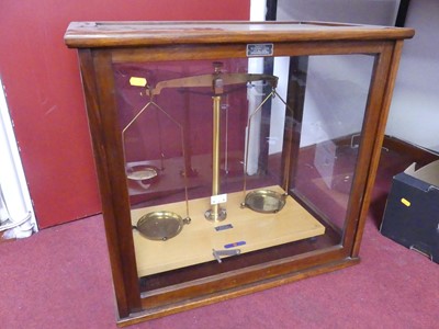 Lot 489 - A pair of 20th century balance scales, housed...