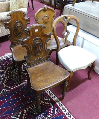 Lot 1328 - A pair of mid Victorian scroll oak panelled...