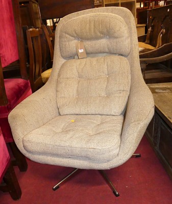 Lot 1345 - A 1960s pale fabric upholstered swivel bucket...