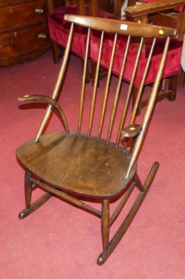 Lot 1346 - A Danish stained beech stickback rocking elbow...