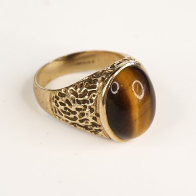 Lot 326a - A modern carved 9ct gold cabochon tigers eye...