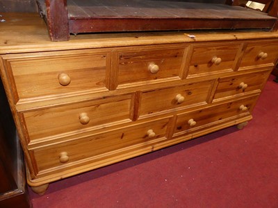 Lot 1387 - A modern pine round cornered low side chest,...