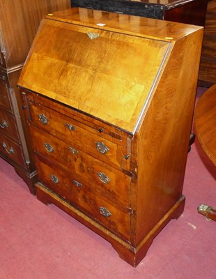 Lot 1394 - A figured walnut and crossbanded slope front...