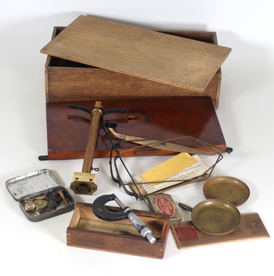 Lot 521 - An early 20th century brass balance scale, in...