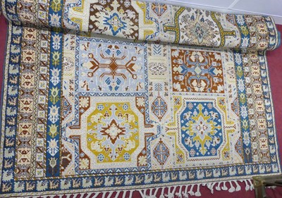 Lot 1408 - A Turkish woollen multi-ground coloured Oushak...