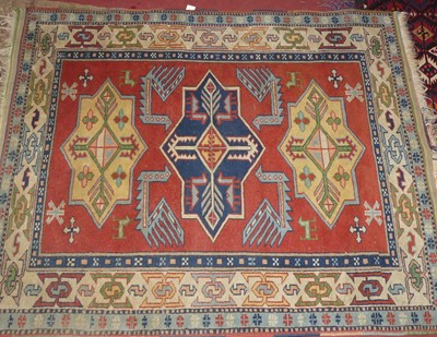 Lot 1413 - An Afghan woollen red, blue, and cream ground...