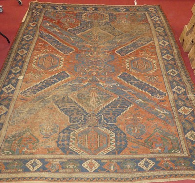 Lot 1416 - A Persian woollen red, blue, and cream ground...