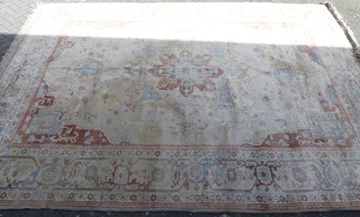 Lot 1417 - A machine woven pale ground woollen floral...