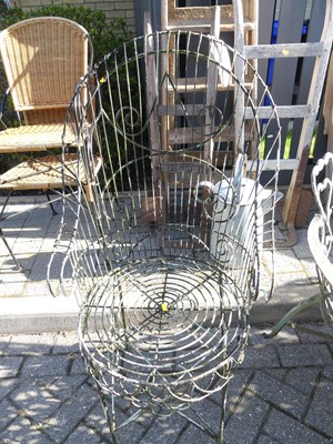 Lot 1441 - A wired metal scroll garden chair, width 62cm