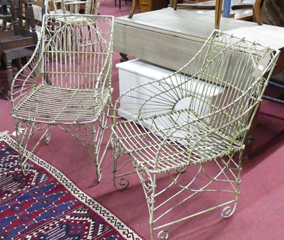 Lot 1444 - A pair of white painted wired metal garden...
