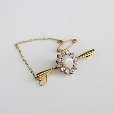 Lot 2040 - A 9ct yellow and white gold, opal and white...