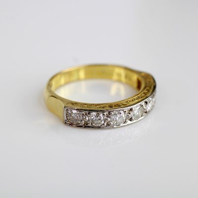 Lot 2044 - An 18ct yellow gold diamond half eternity ring,...
