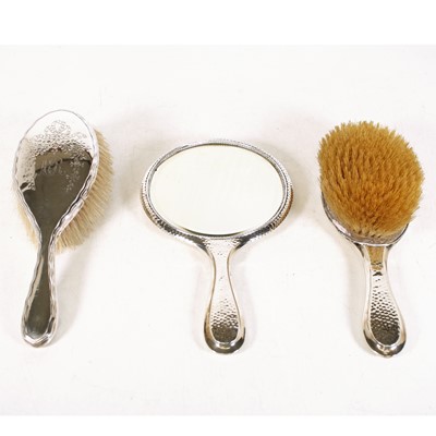 Lot 244 - An Edwardian silver-backed dressing table duo,...