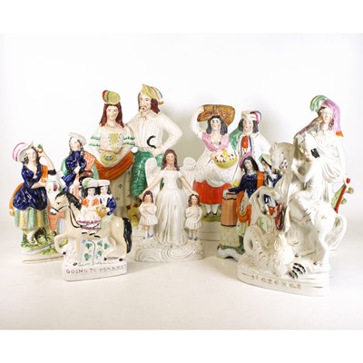 Lot 35 - A collection of eight Staffordshire flatback...