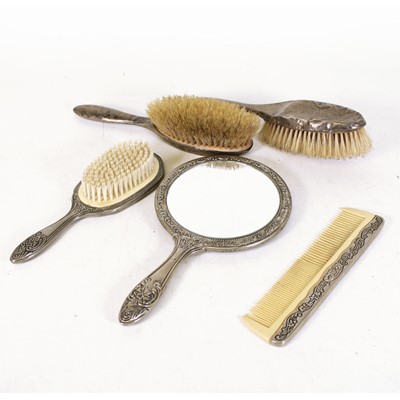 Lot 242 - A pair of George V silver-backed hairbrushes,...
