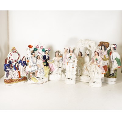 Lot 26 - A collection of eight Staffordshire flatback...