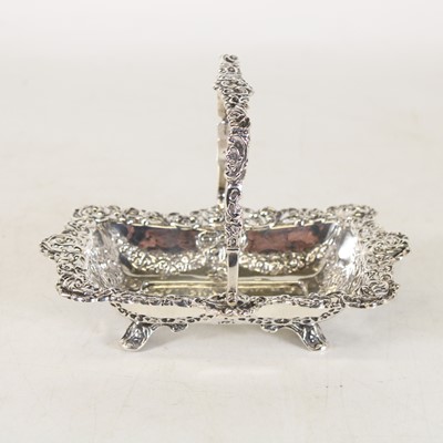 Lot 264 - A George V silver swing-handled table basket,...