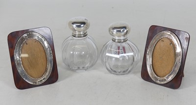 Lot 251 - A pair of silver-capped glass dressing table...