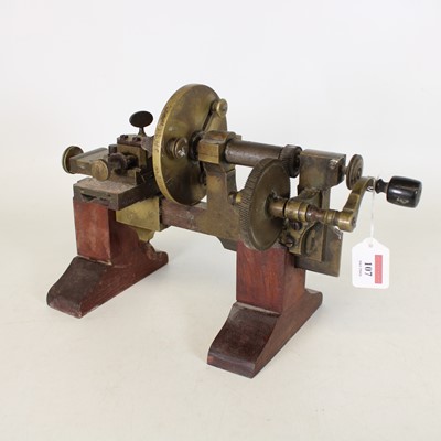 Lot 107 - A hand operated watchmakers lathe, having a...