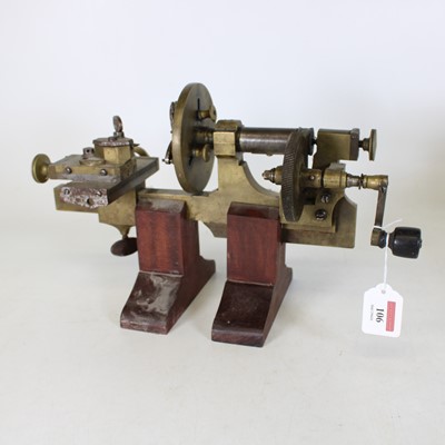 Lot 106 - A hand operated watchmakers lathe, having a...