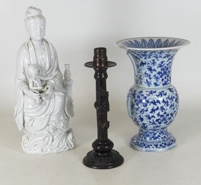 Lot 81 - A Chinese blanc-de-chine figure of Guanyin,...