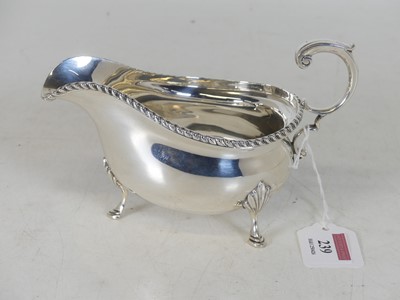 Lot 239 - A George VI silver cream jug, having gadrooned...