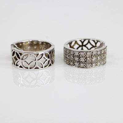 Lot 2072 - A pair of 18ct white gold diamond huggy hoop...