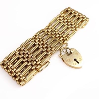 Lot 2078 - An 9ct yellow gold gatelink bracelet with...