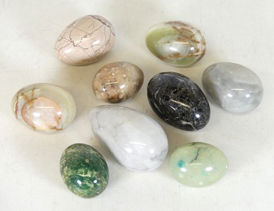 Lot 78 - A collection of nine polished hardstone eggs,...