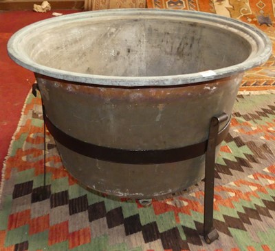 Lot 625 - A copper log basket of circular shape, on...