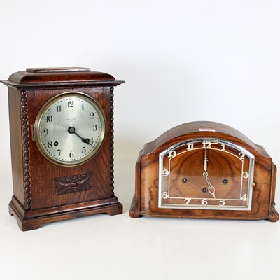 Lot 19 - An Art Deco walnut cased mantel clock, the...