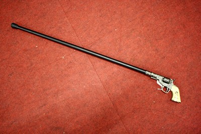 Lot 39 - A novelty walking stick, the handle in the...