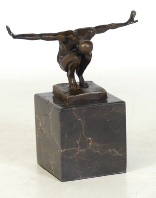 Lot 84 - A contemporary bronzed metal figure of a man,...