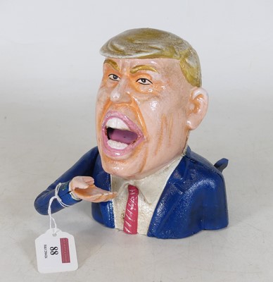 Lot 88 - A reproduction painted metal moneybox in the...