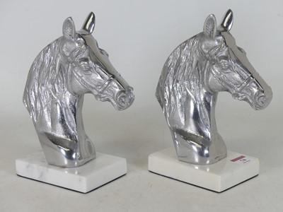 Lot 74 - A pair of contemporary polished metal horse...