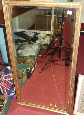 Lot 513 - A gilt framed and bevelled rectangular wall...