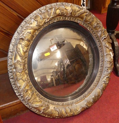 Lot 487 - A Victorian gilt composition framed convex...