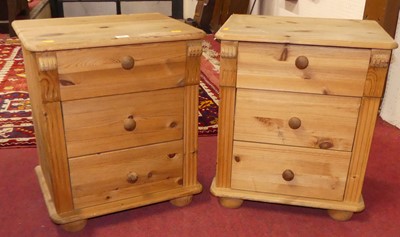 Lot 501 - A pair of pine three-drawer bedside chests,...