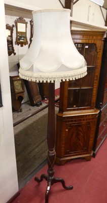 Lot 524 - A mahogany lamp stand as a reeded column on...