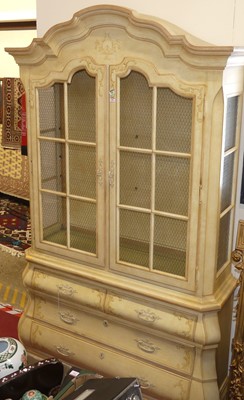 Lot 562 - A continental style cream polychrome painted...