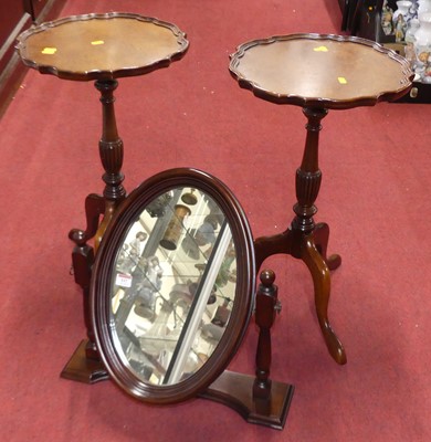 Lot 537 - A pair of reproduction mahogany pedestal wine...