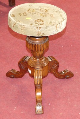 Lot 544 - A mid Victorian faux rosewood revolving piano...