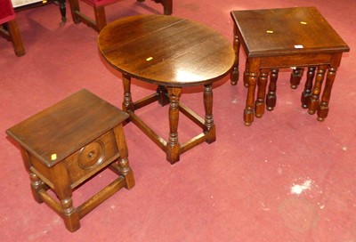 Lot 547 - A reproduction oak nest of three occasional...